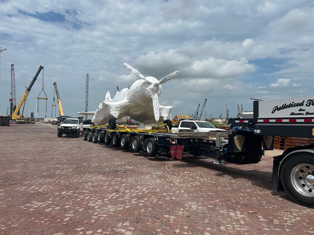 Palletized heavy haul load staged at Houston port facility on multi-axle trailer